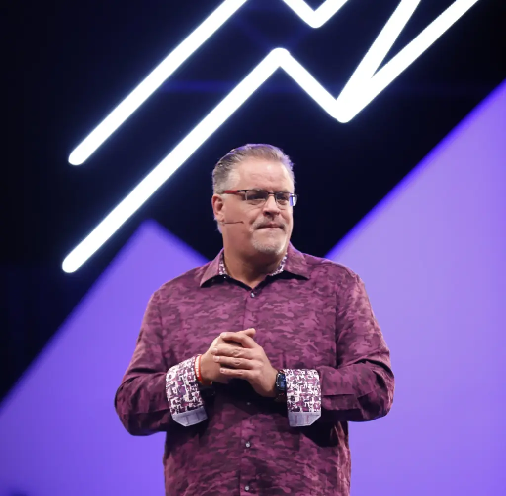 Pastor Craig at Rhema Bible Church purple background