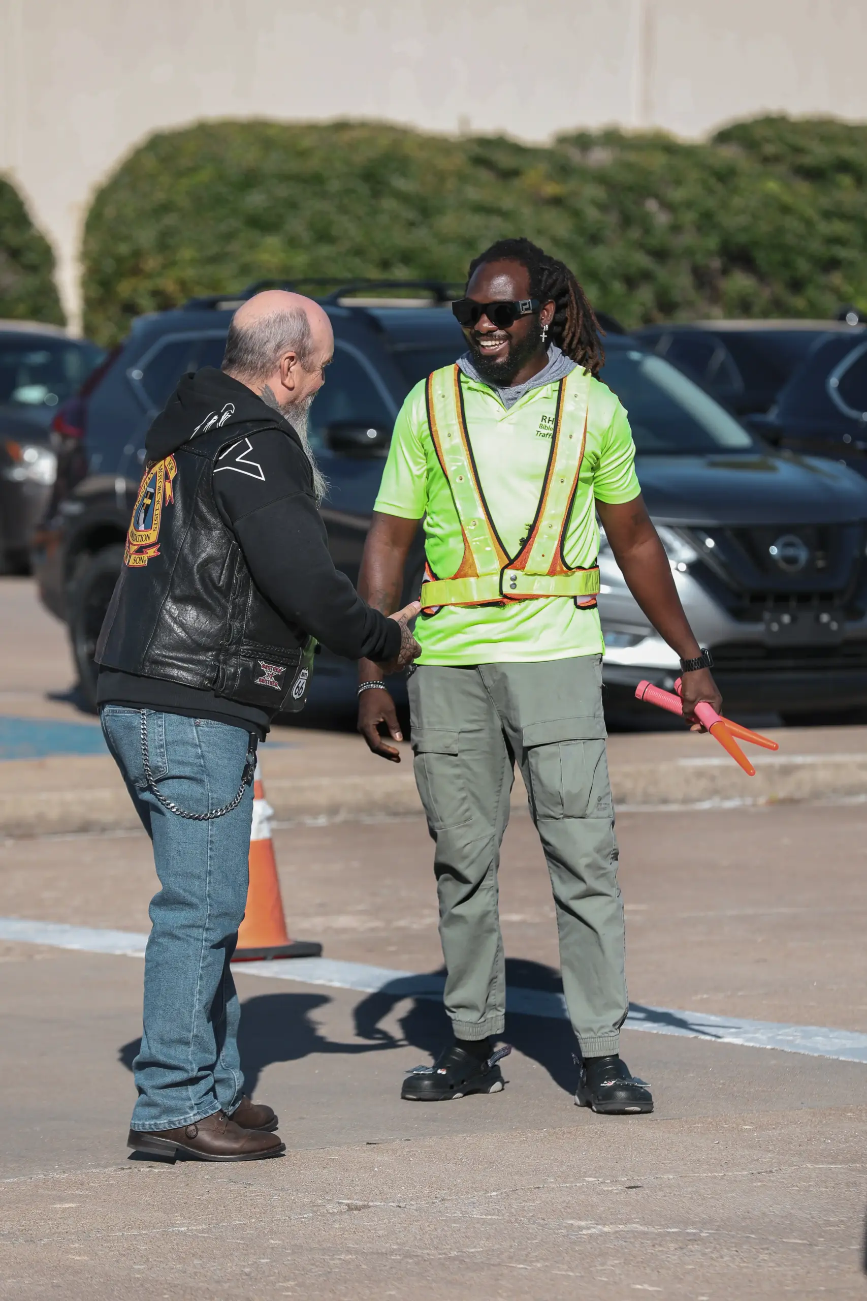 Traffic team smiling and greeting member at Rhema Bible Church