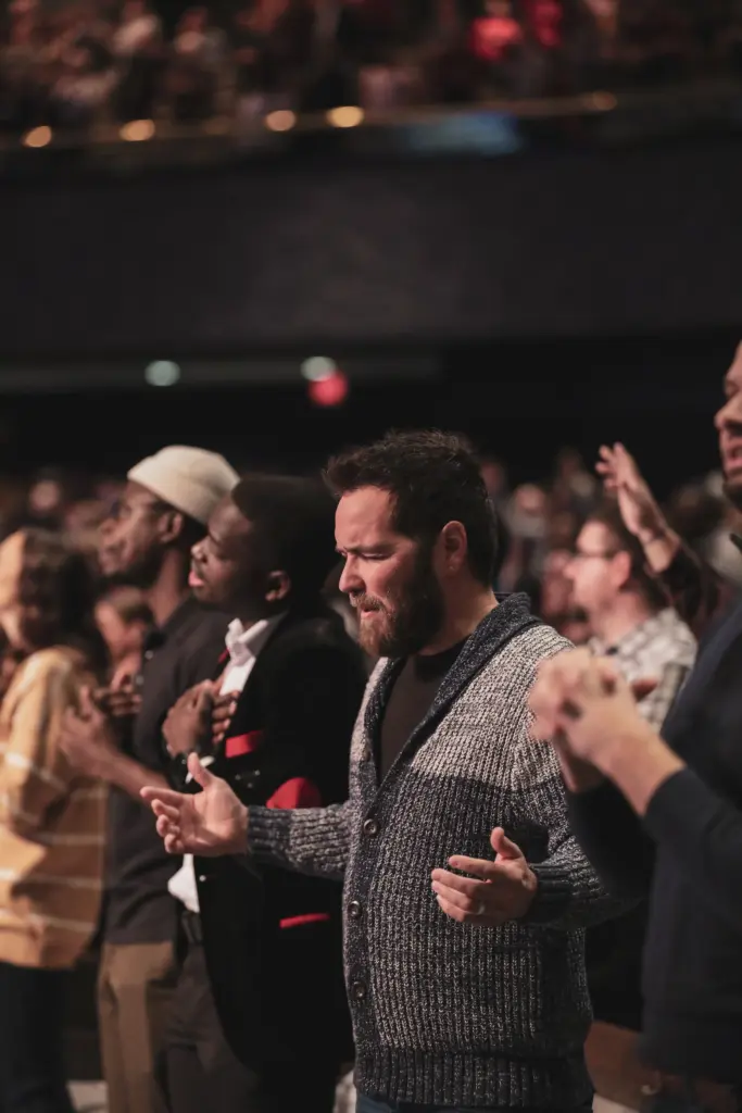 Congregation worshiping at Rhema Bible Church