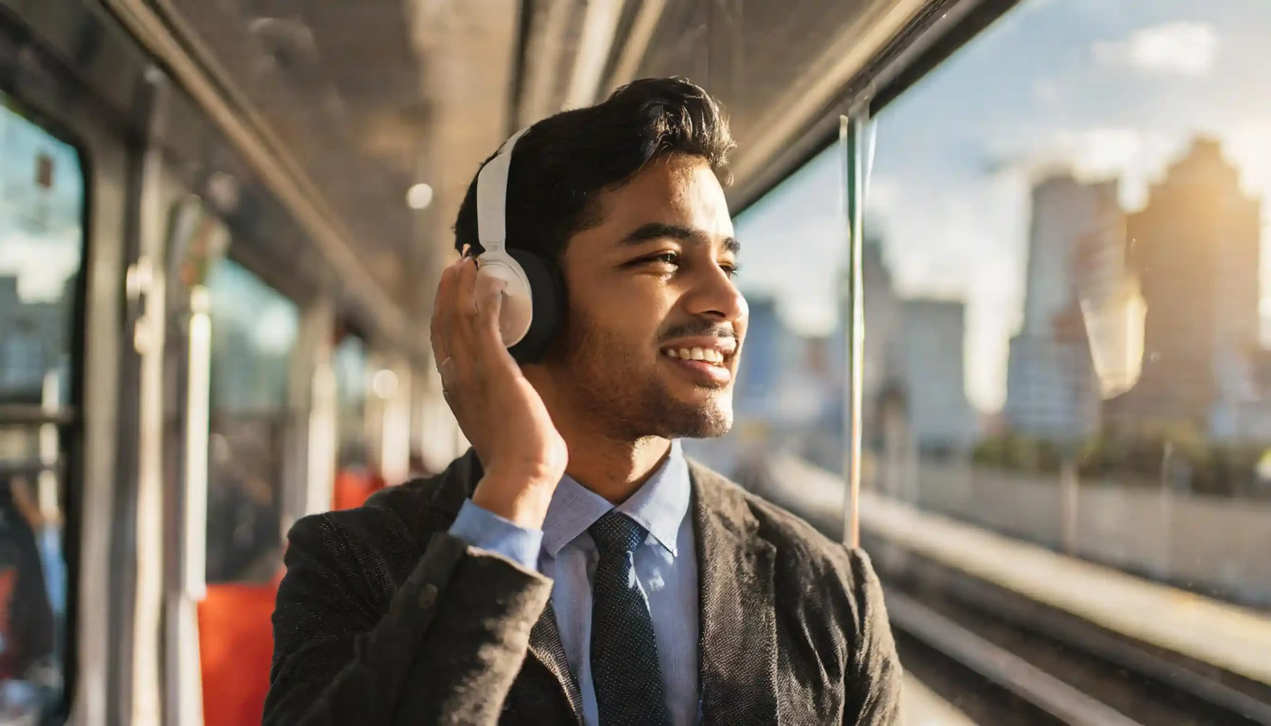 A person donning headphones and engaging in active listening to a podcast or audiobook in a